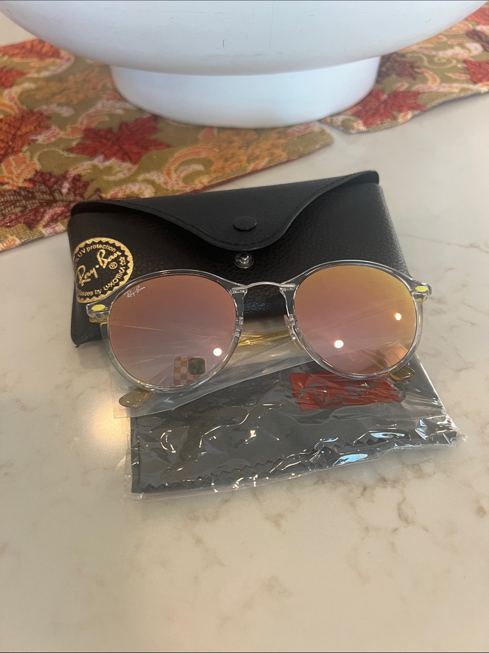 Ray-Ban Women's Clear Frame Sunglasses with Rose Gold Mirrored Lenses